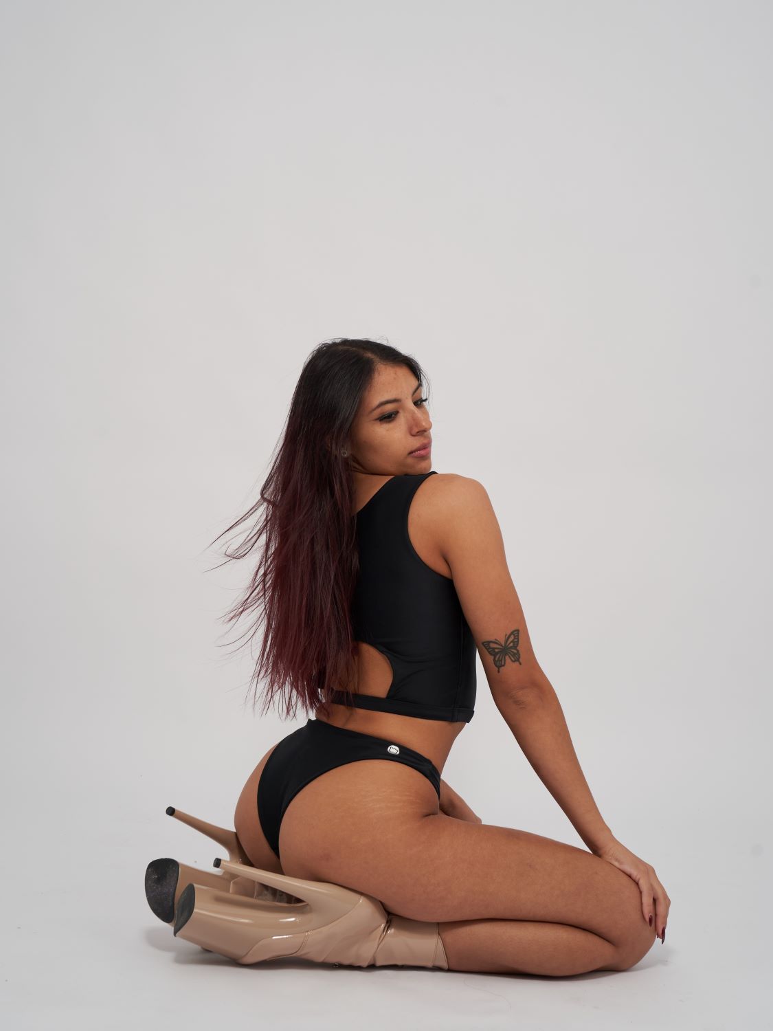 Black reversible polewear top with versatile design, Adrienne Reversible Top and Low Waist Bottoms by Poler Bare Boutique